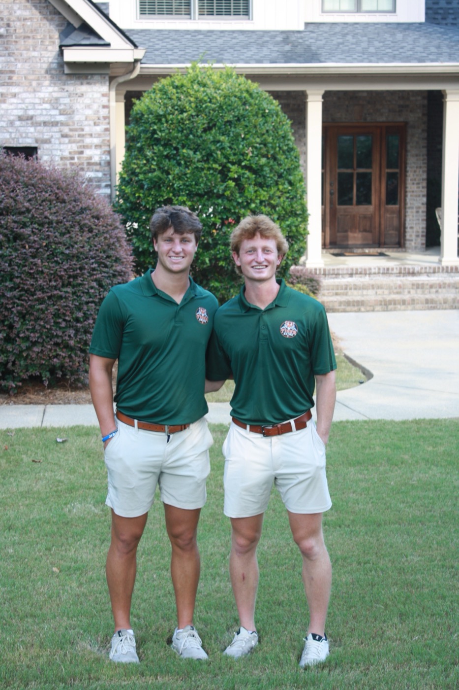 Cayson Keller and Henry Goldsmith of Tiger Shine standing together in front of a home in Auburn